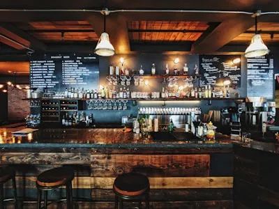 Rustic London gastropub interior featuring polished wood and craft beer taps