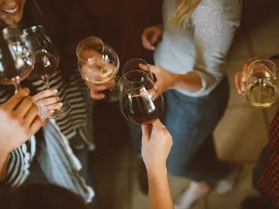 A lively group of friends enjoying gourmet food and wine in London